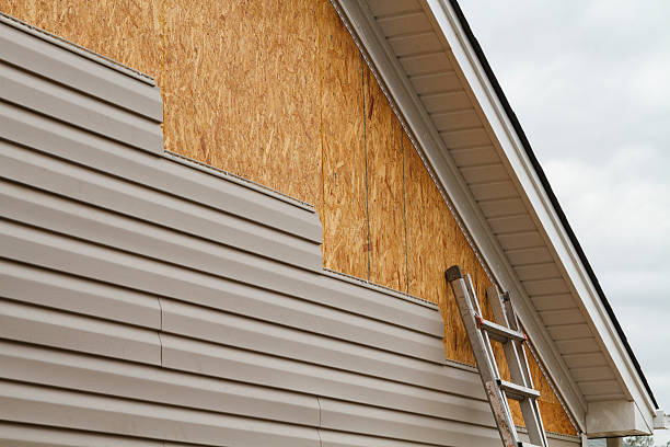 Professional Emergency Siding Repair technician working in Saxton, PA